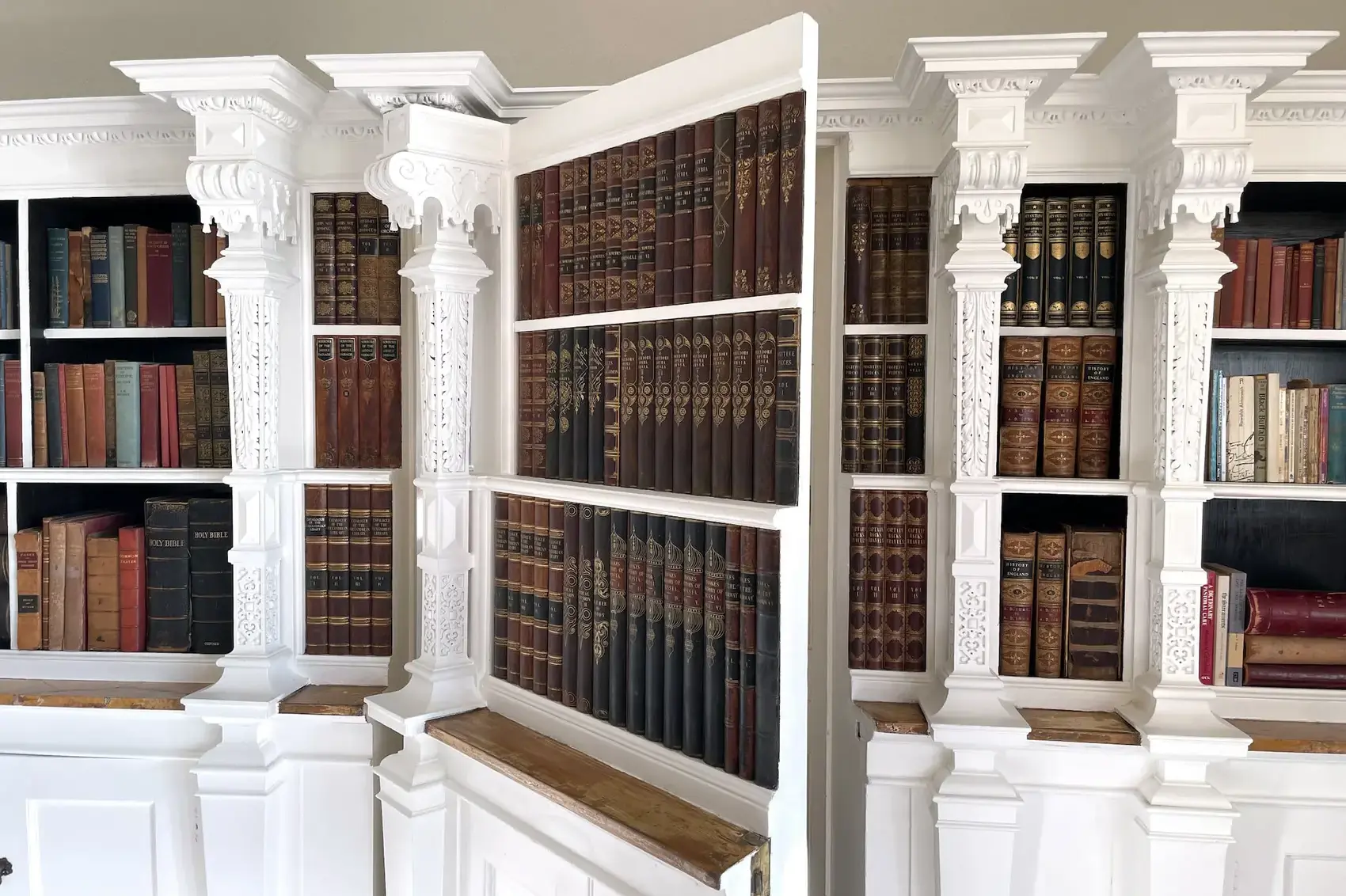 Picture shows a secret door behind bookshelves