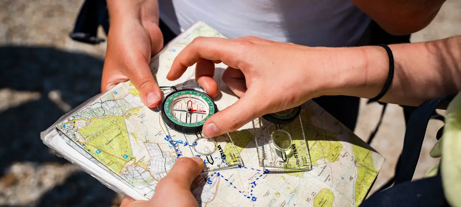 Image of a map with a compass on top