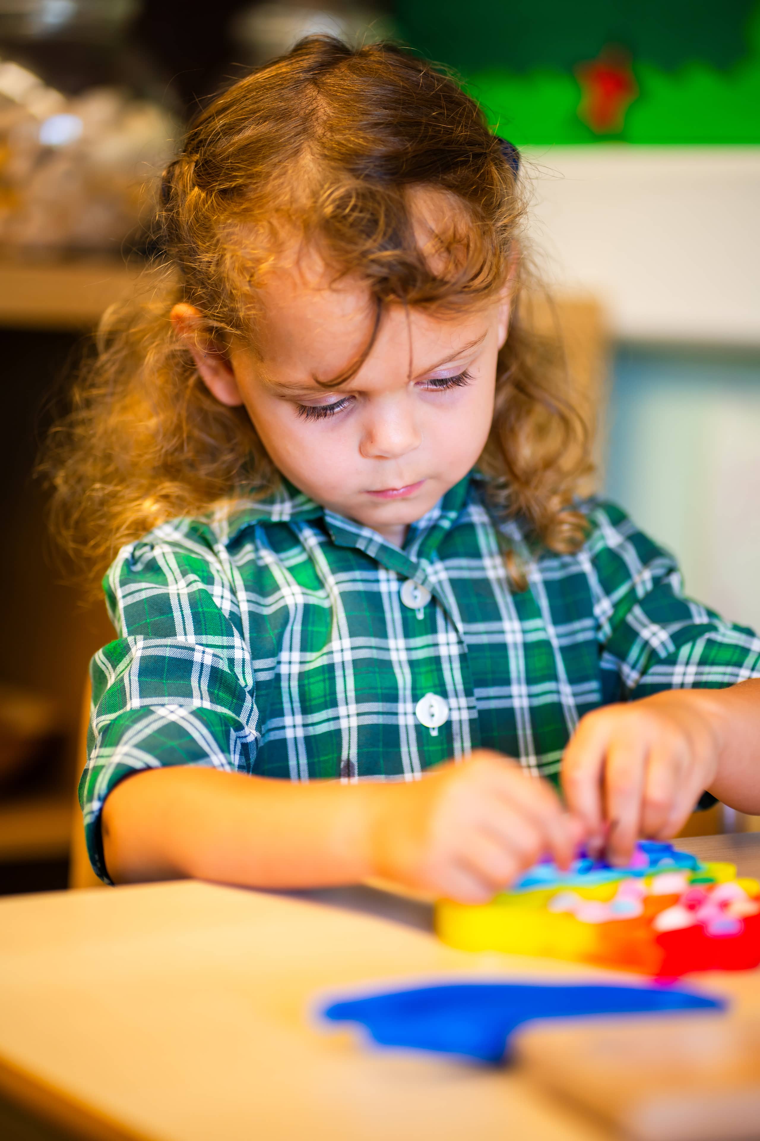 Embley pre-school pupil playing with toys