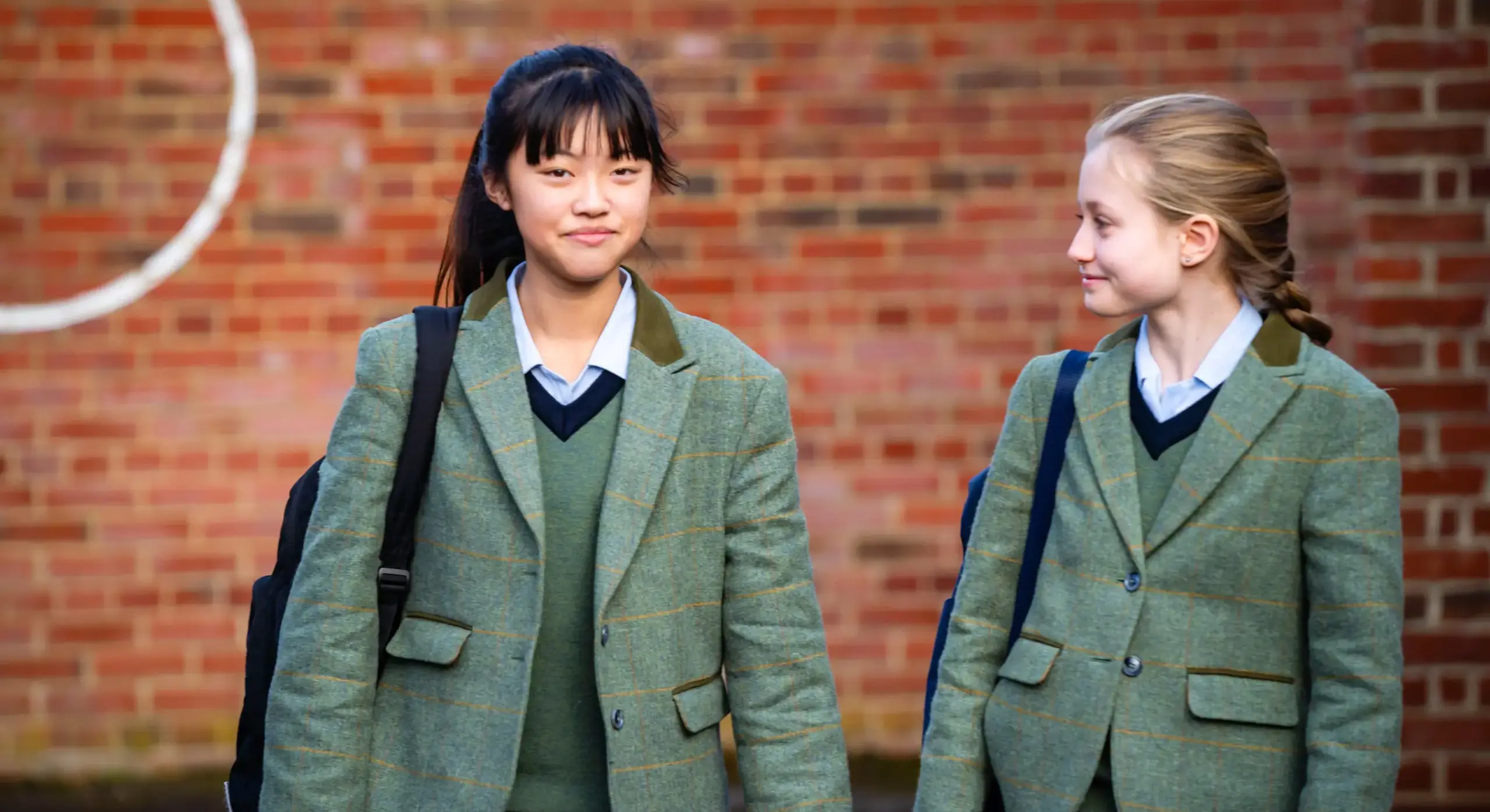 Two Embley senior pupils walking outside