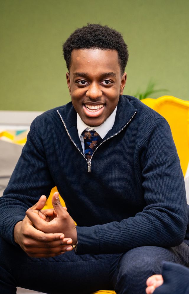 Embley Sixth Form student smiling at friends