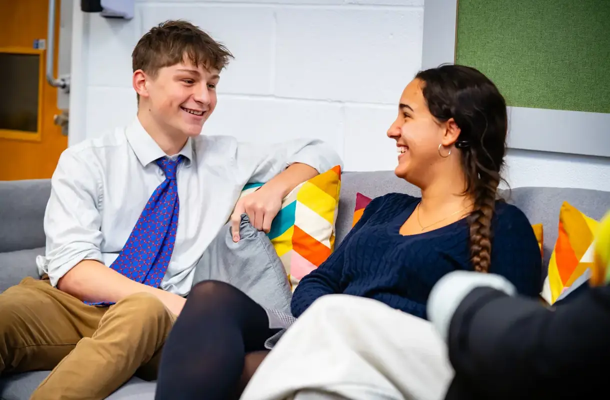 Two Embley Sixth Form Students sitting on sofa