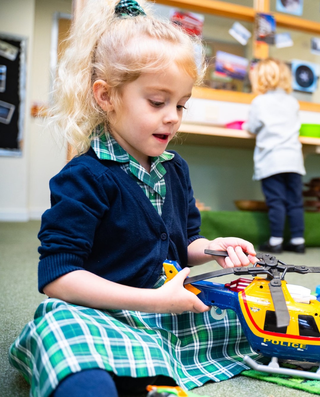 Embley pre-school pupil playing with toys