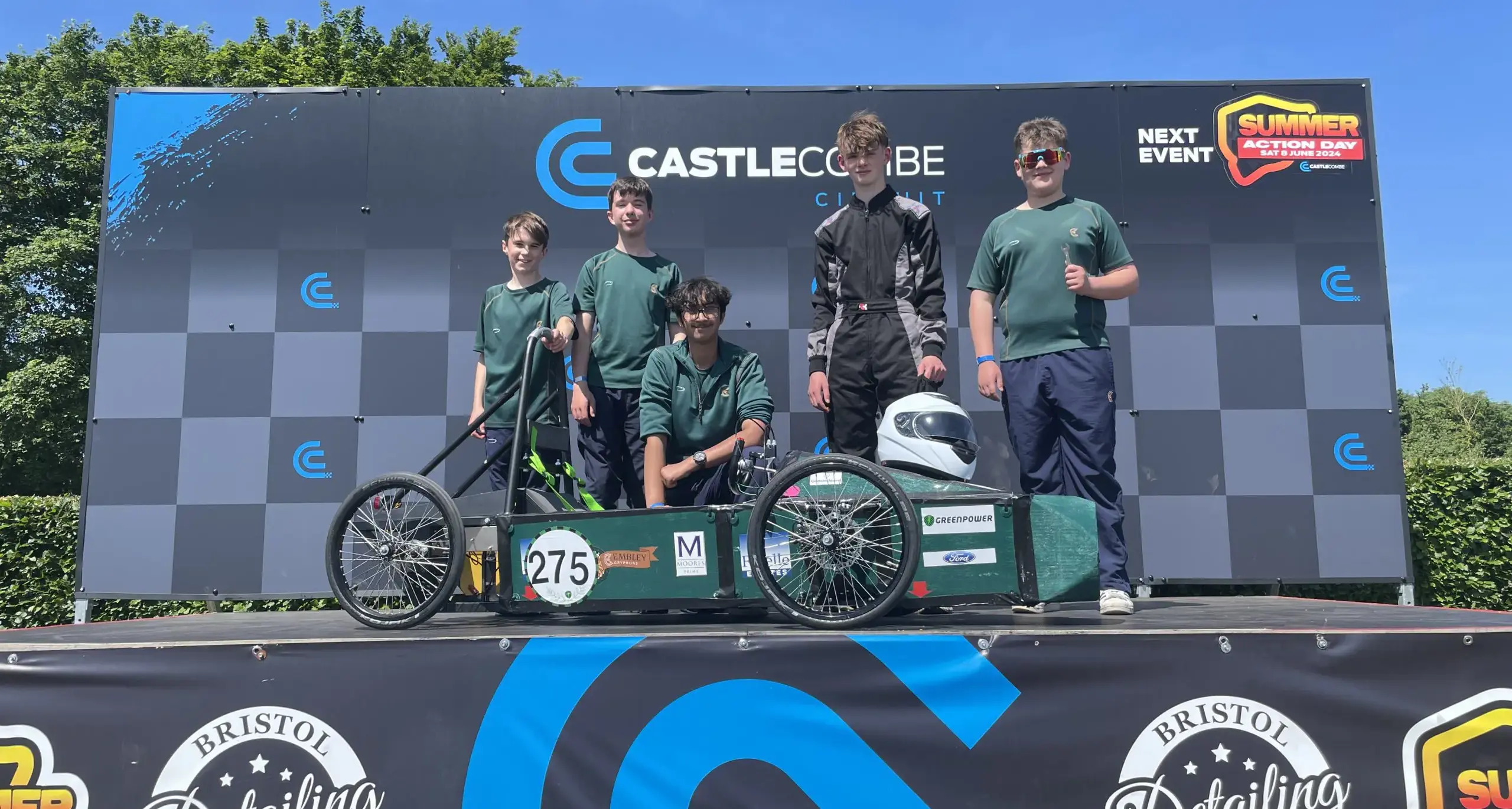 Pupils with their electric green car